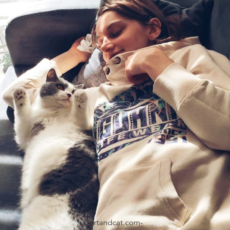 smiling girl with british cat blue and white slow life in cat's way hygge